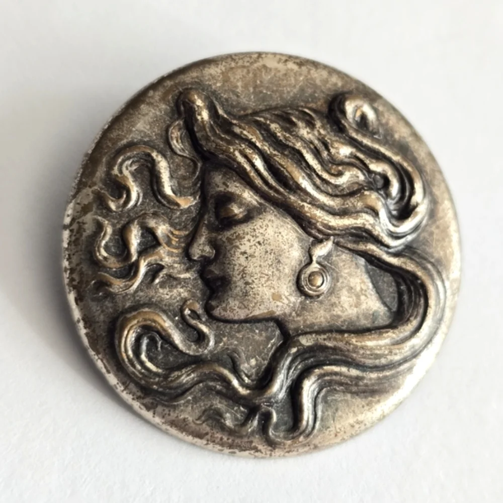 Art Nouveau style brooch woman with flowing hair dark silver tone pin